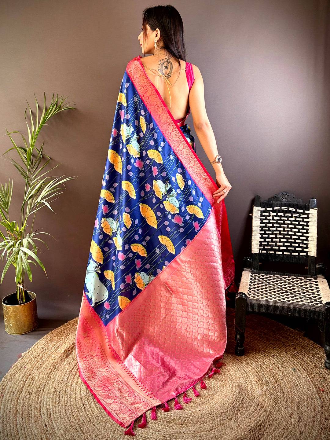 Back view of navy blue saree with Pichwai Kalamkari print and pink border