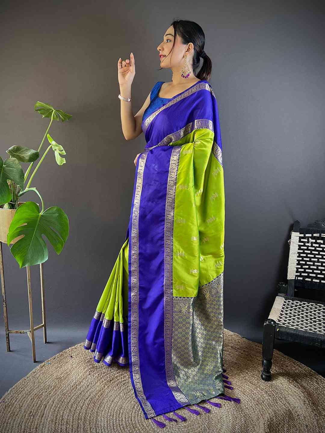 Model showcasing Gadhwal silk saree in vibrant colors
