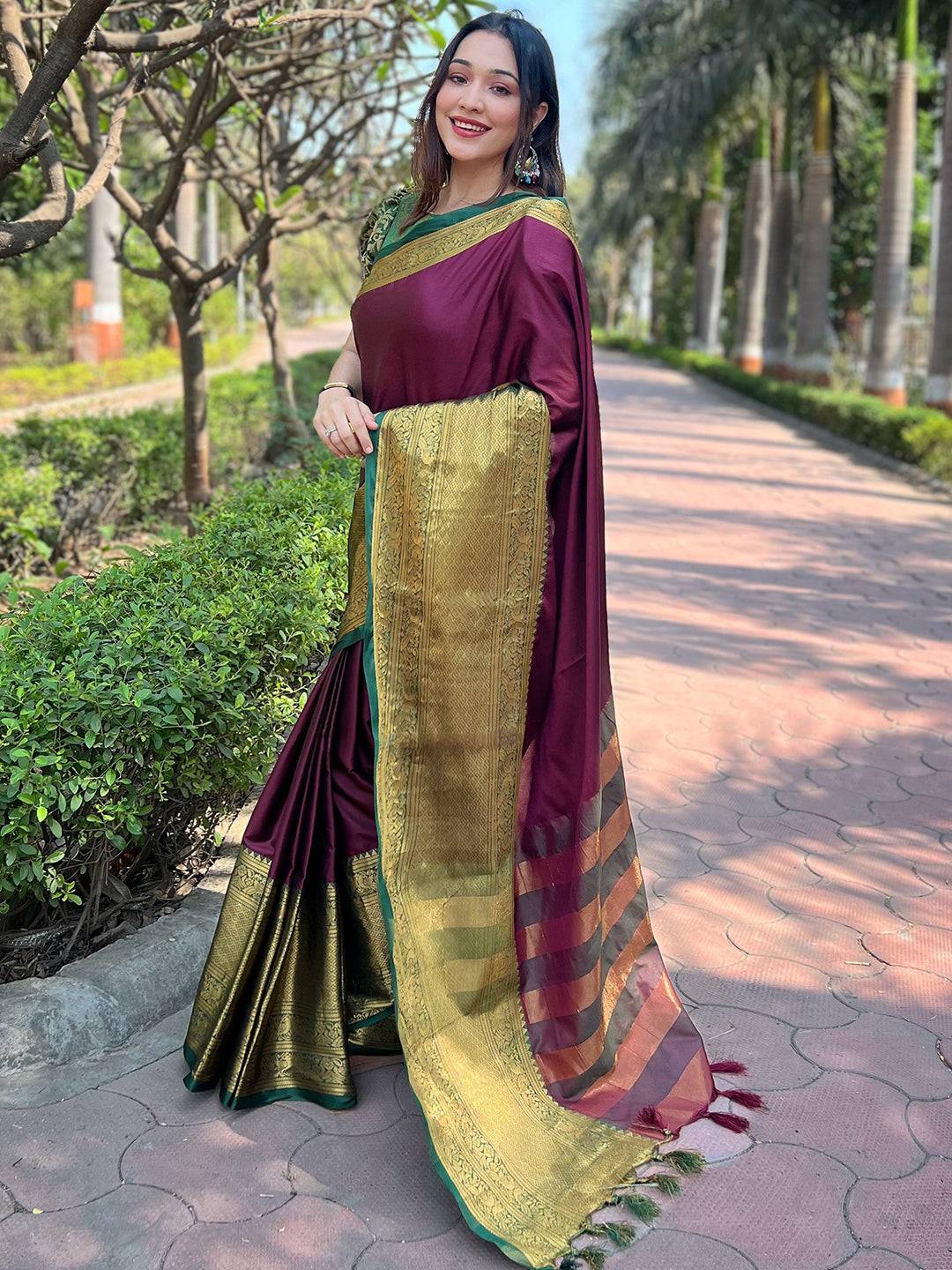Wine and gold Kanjivaram saree with intricate border design
