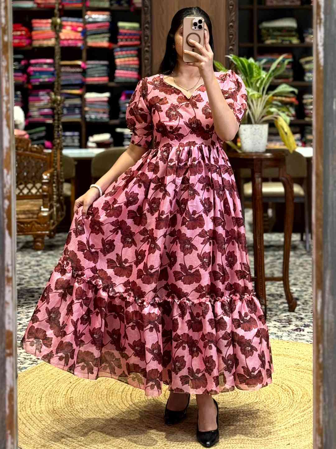 Baby Pink Floral Print Midi Dress with puff sleeves and tiered skirt, perfect for an elegant and charming look. Shop online at Vastranand.