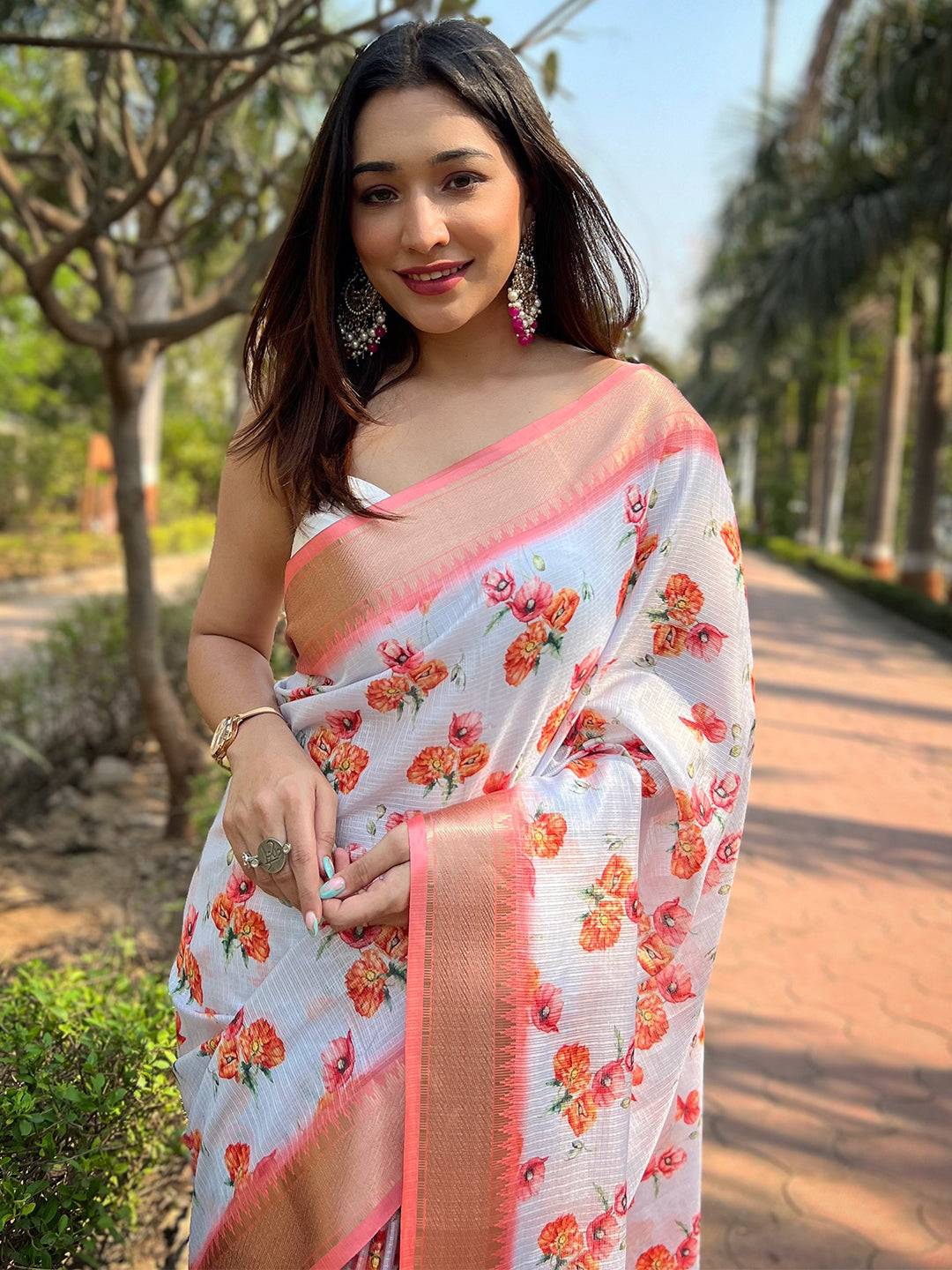 Close-up of Gajari Kota saree with floral print