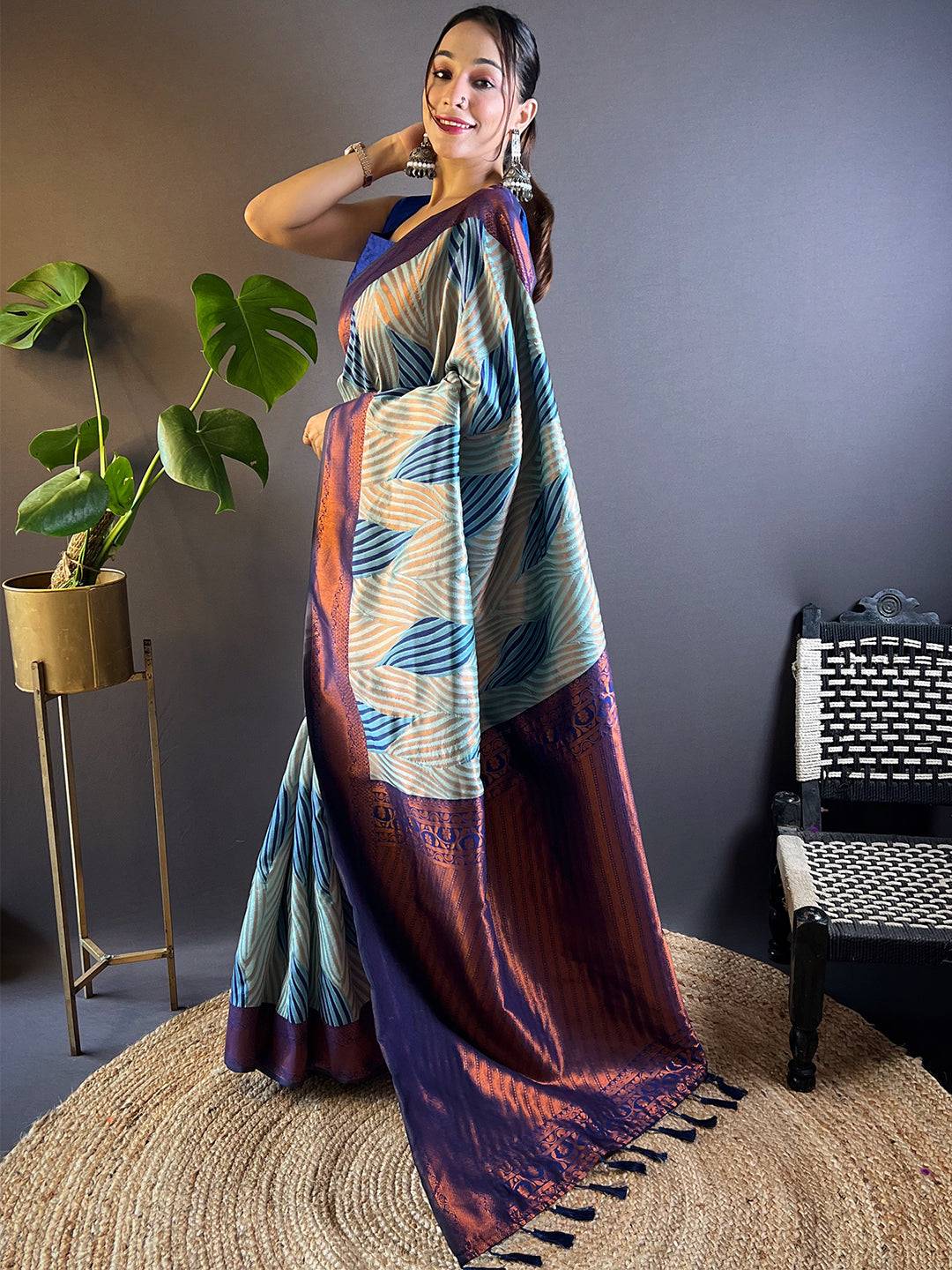 Back view of sky blue Tussar silk Ikkat saree with elegant drape.