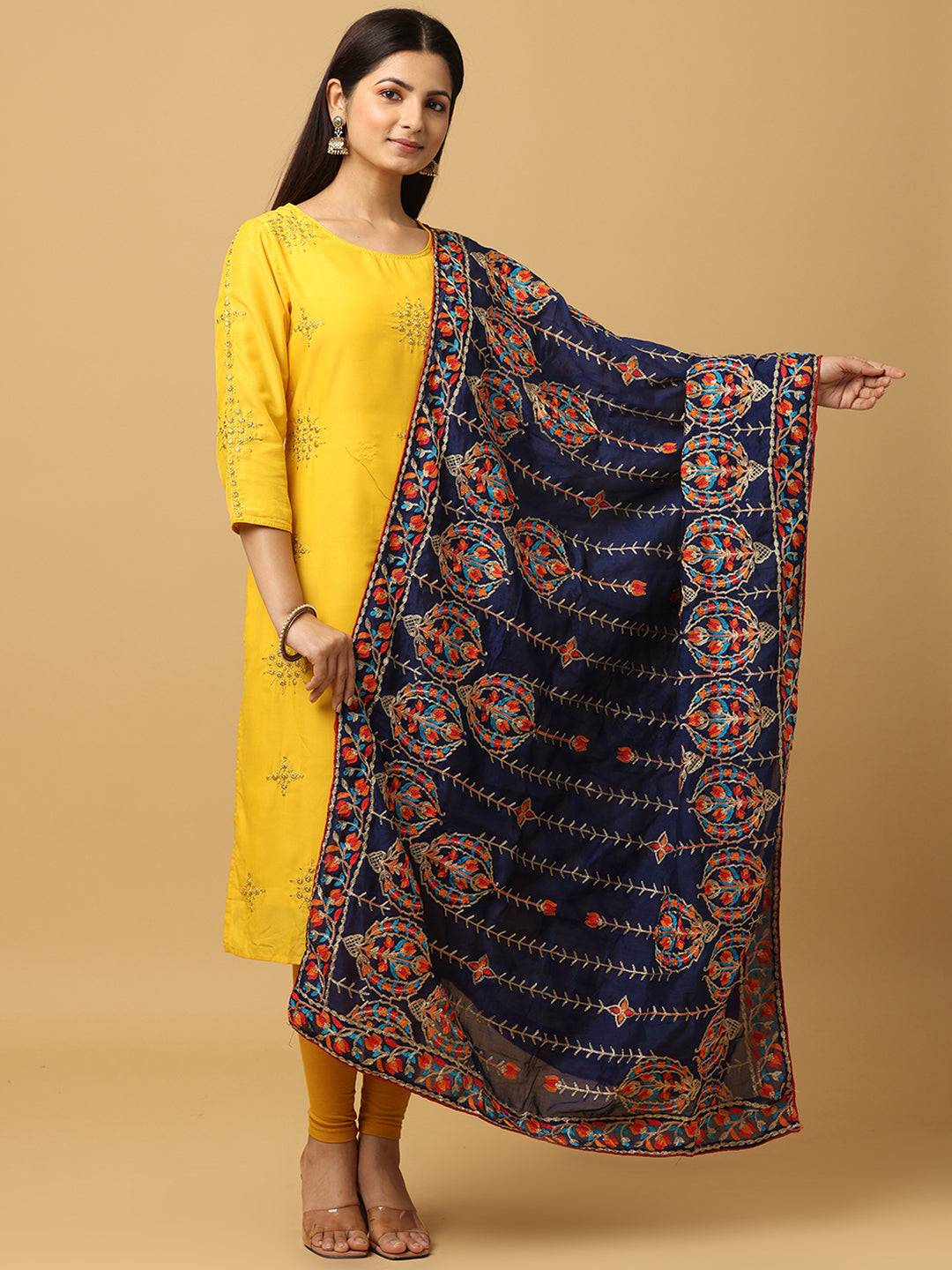 Navy chiffon dupatta with colorful threadwork, worn with yellow outfit.
