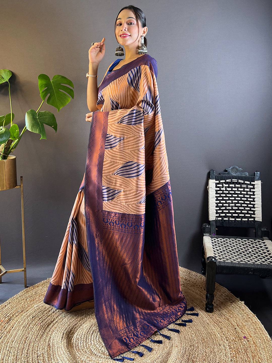 Side pose of model in Peach Tussar Silk Ikkat Saree
