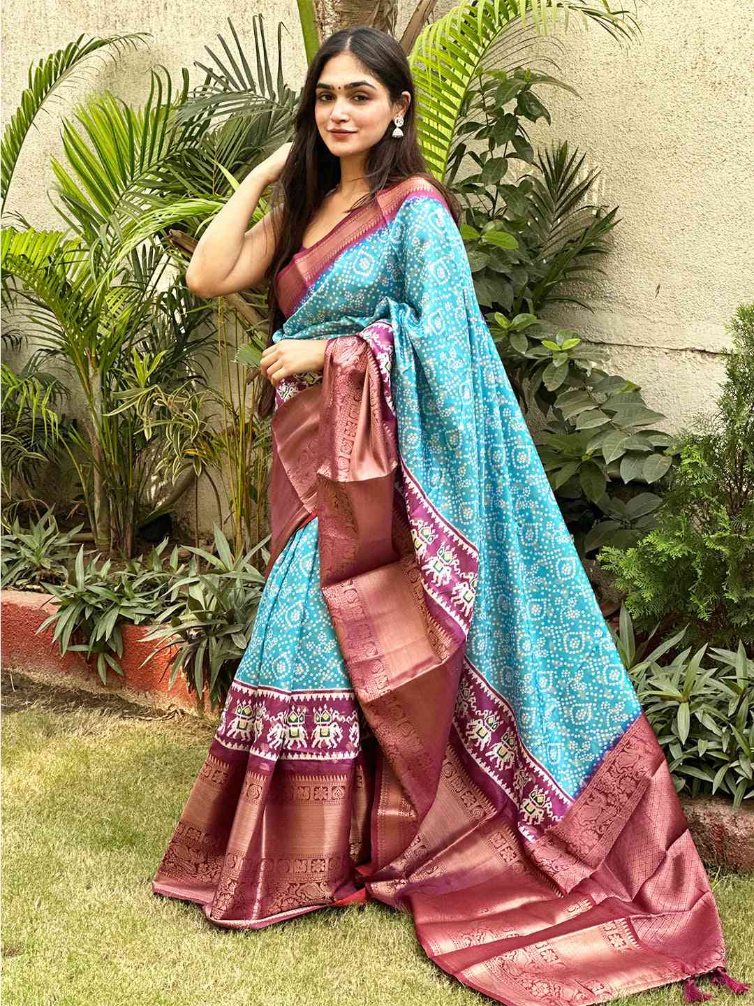 Soft silk Bandhej saree in turquoise with detailed Pattu Zari border