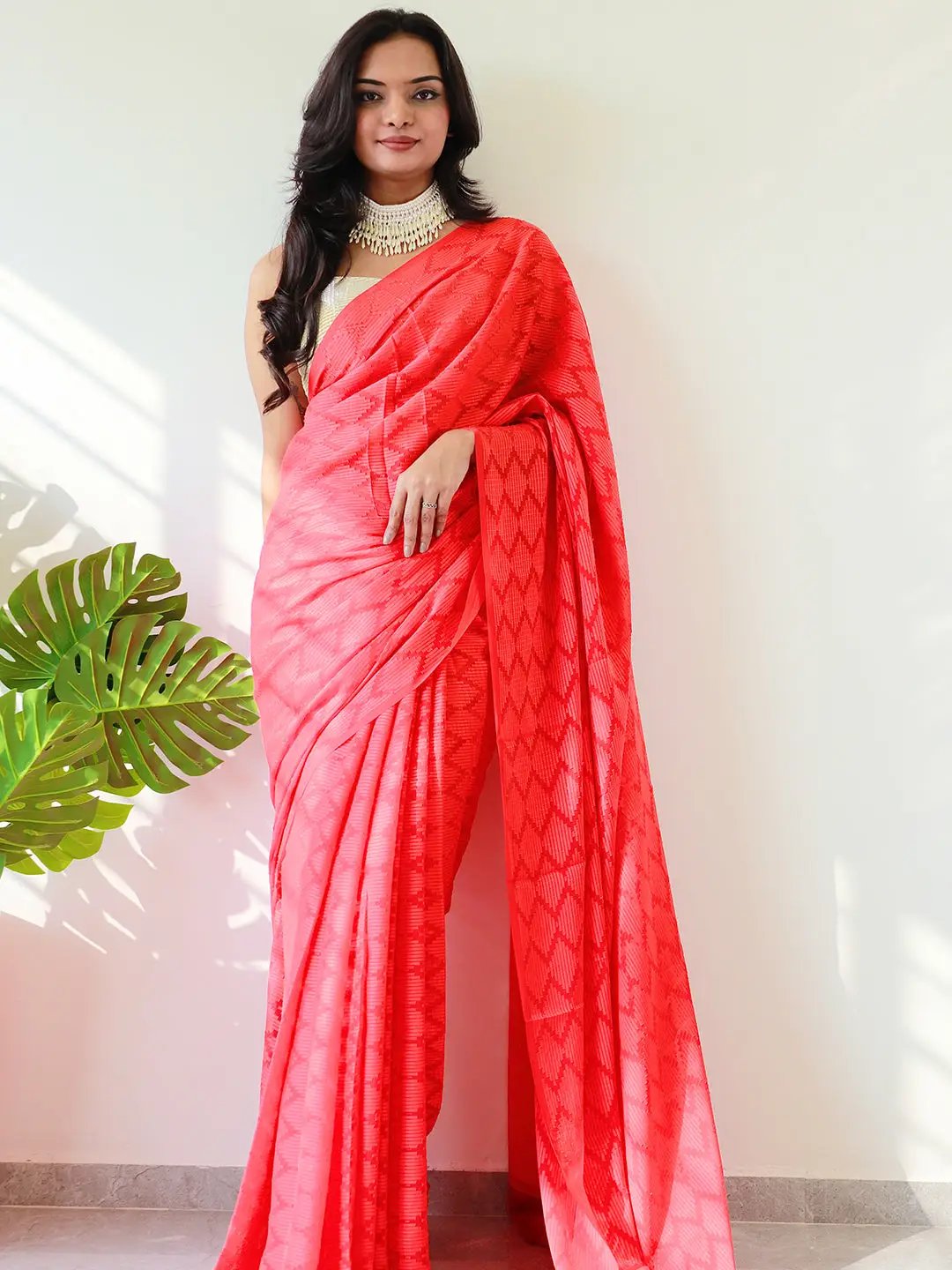 Chic red georgette saree with detailed thread weaving