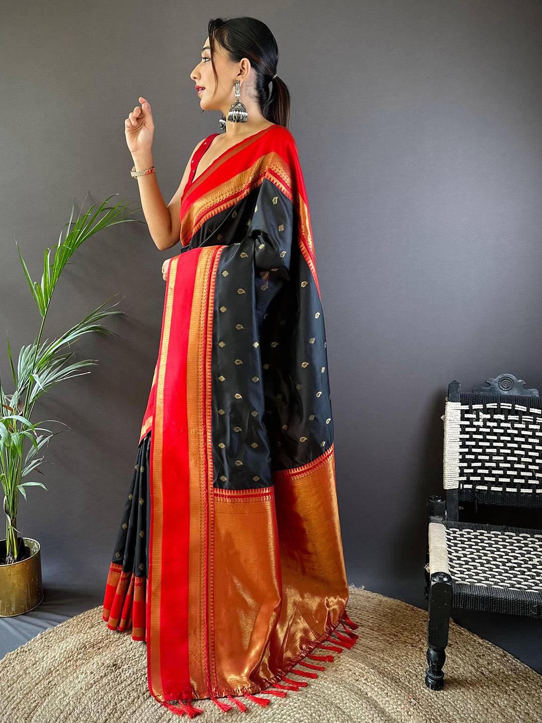 Traditional black Kanchi saree with vibrant red and gold design