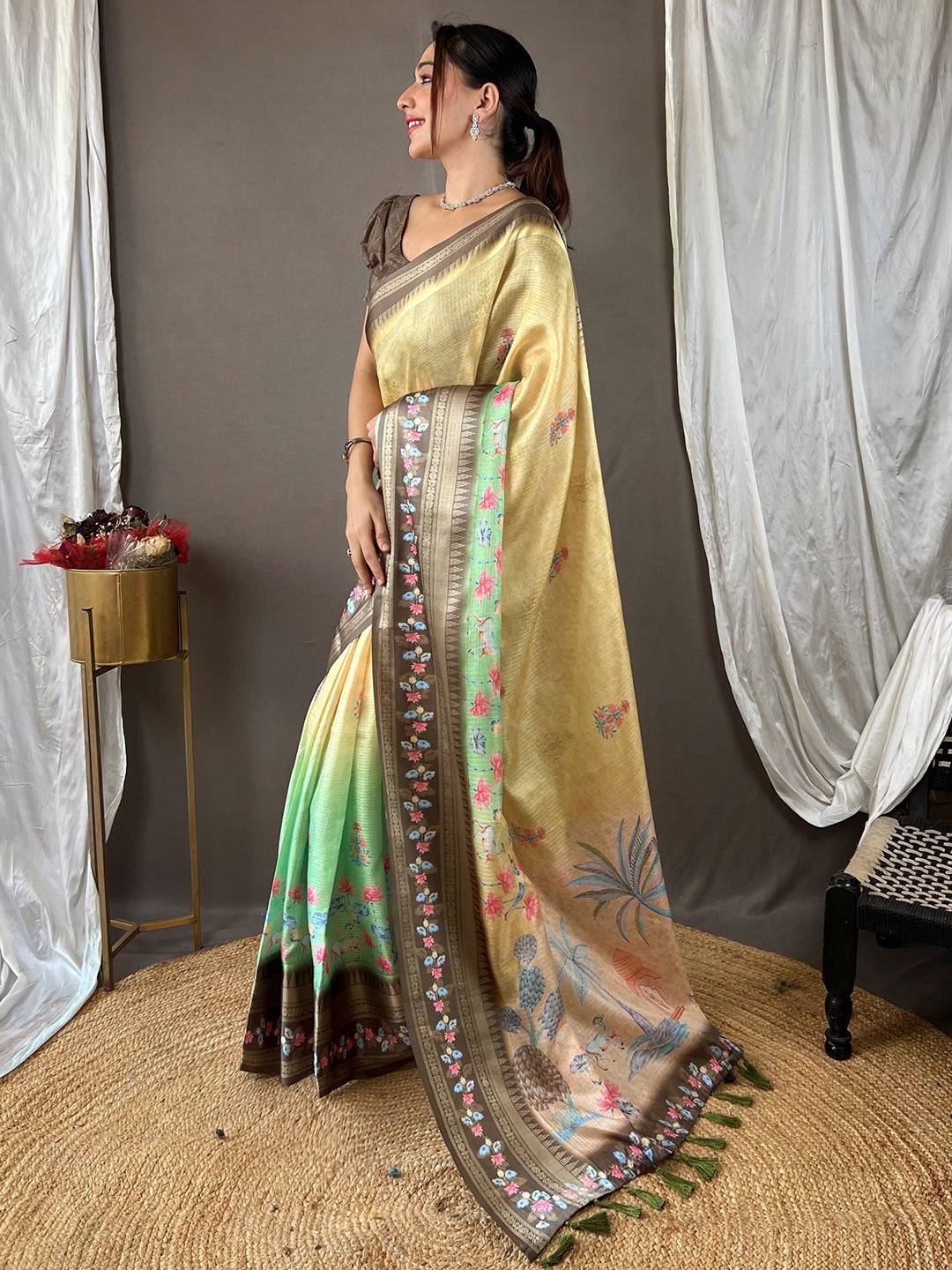 Stylish beige Kota saree with intricate satin border and flowers.