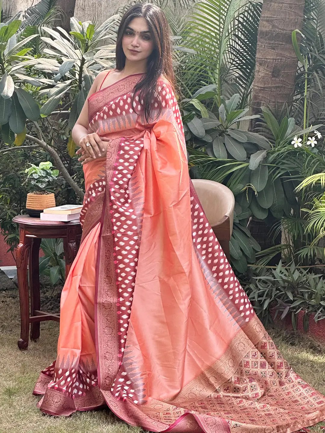 Elegant peach Banarasi saree with intricate Patola pallu design
