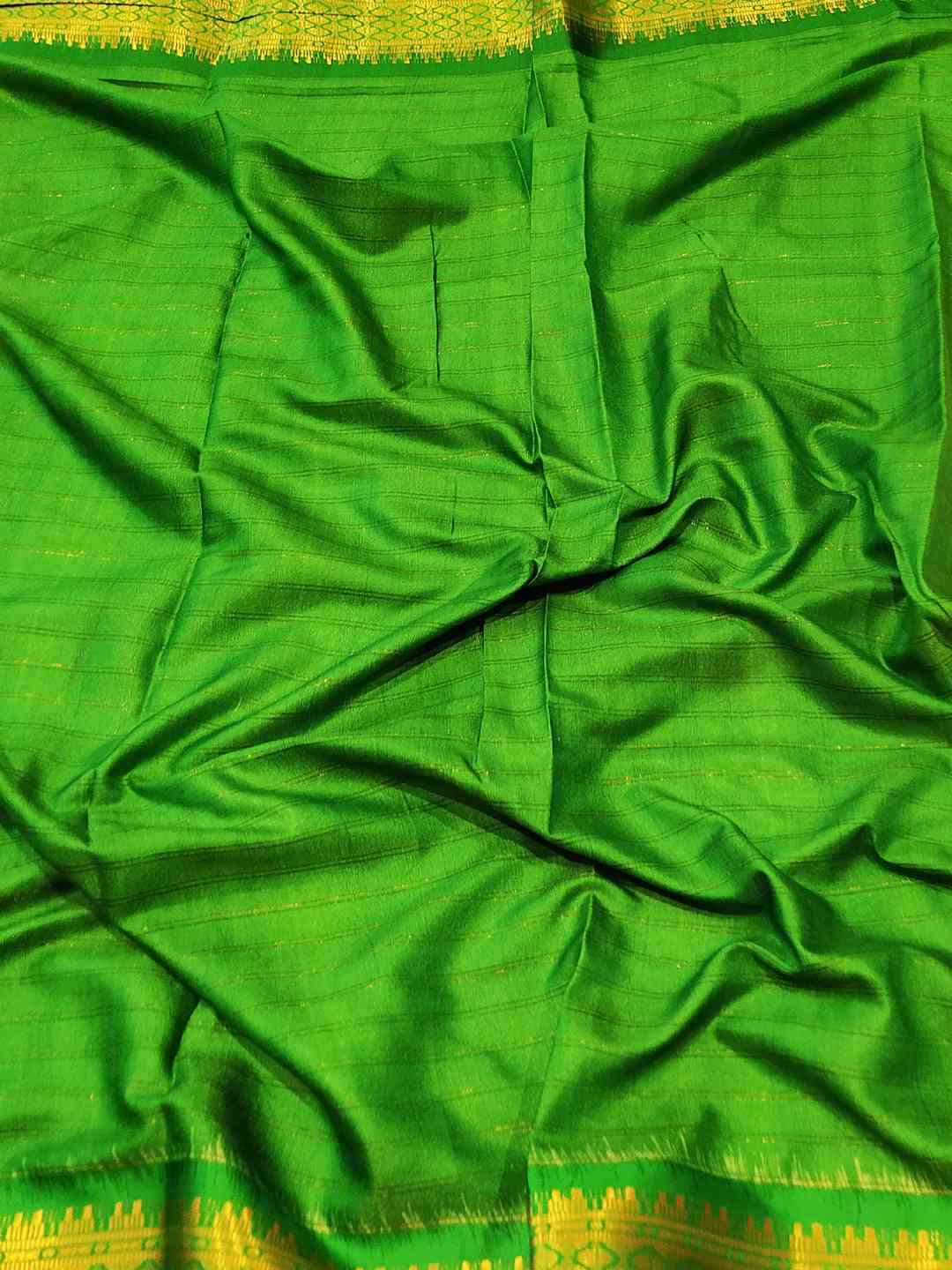 Rich green Uppada Silk fabric with intricate design