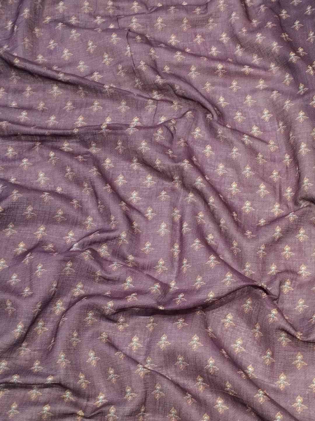 Close-up of Firozi linen saree fabric with print