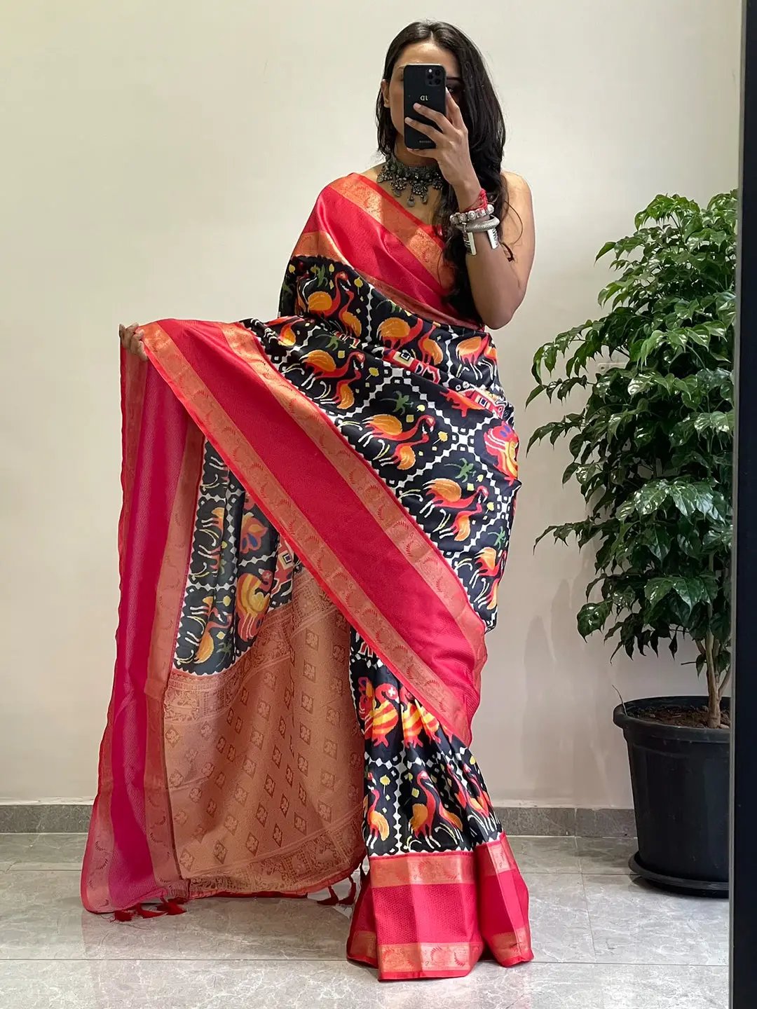 Chic soft silk saree with colorful Pochampally design and Gadwal border.