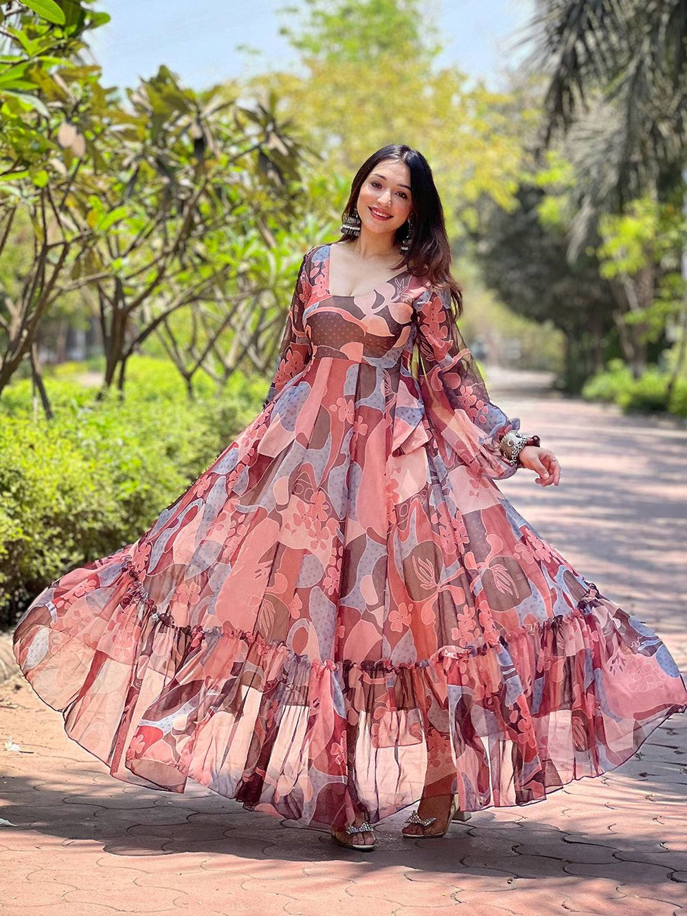 Elegant coffee brown abstract print dress in garden setting