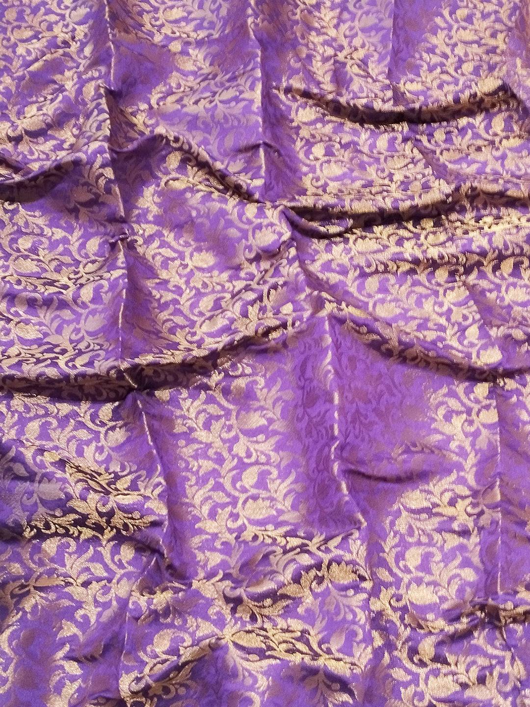 Close-up of purple brocade zari blouse fabric