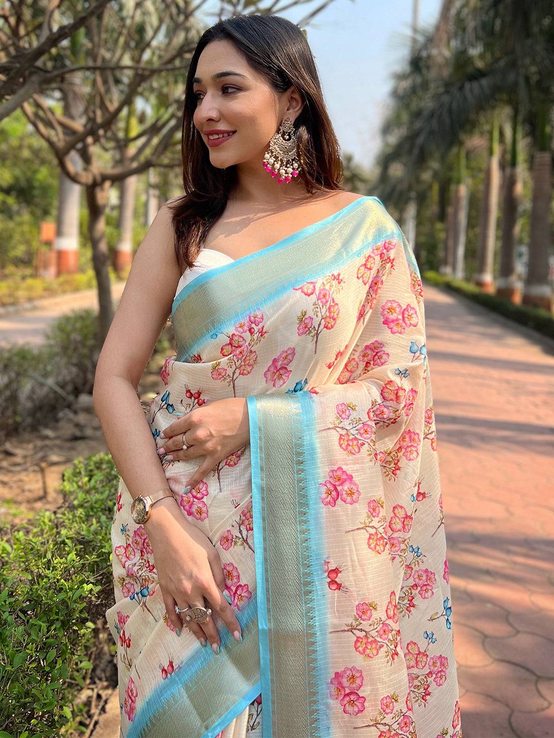 Model wearing Cream Kota saree with digital floral pattern