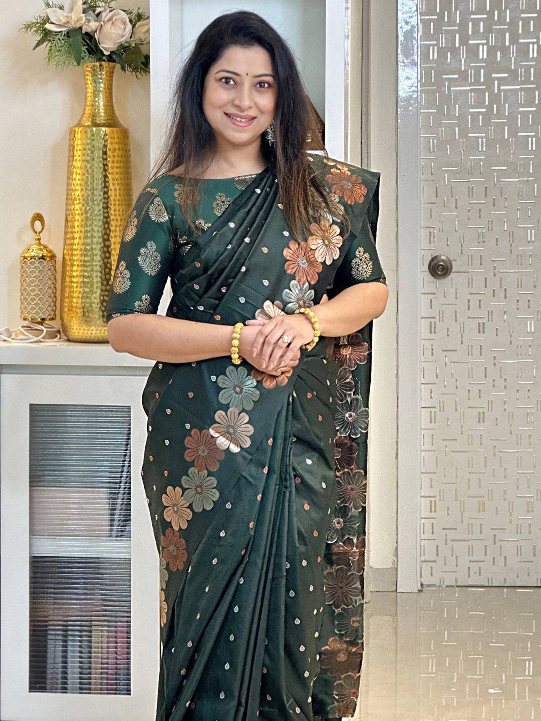 Elegant dark green silk saree with intricate zari work