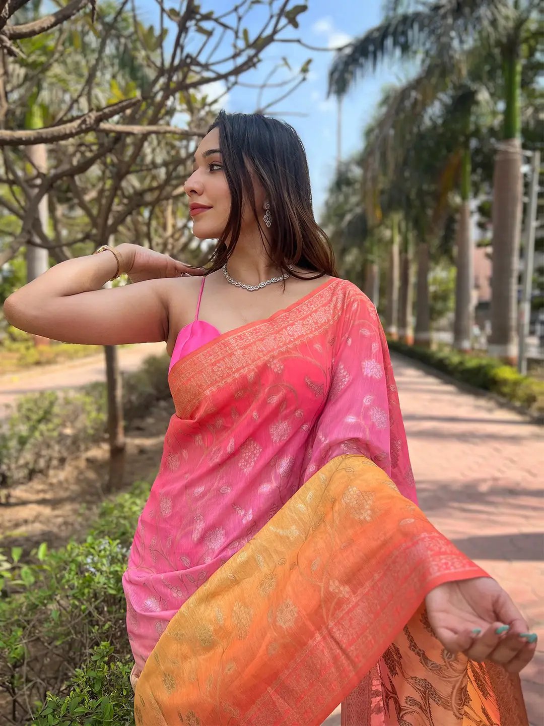 Close-up of pink slub silk saree with intricate zari design