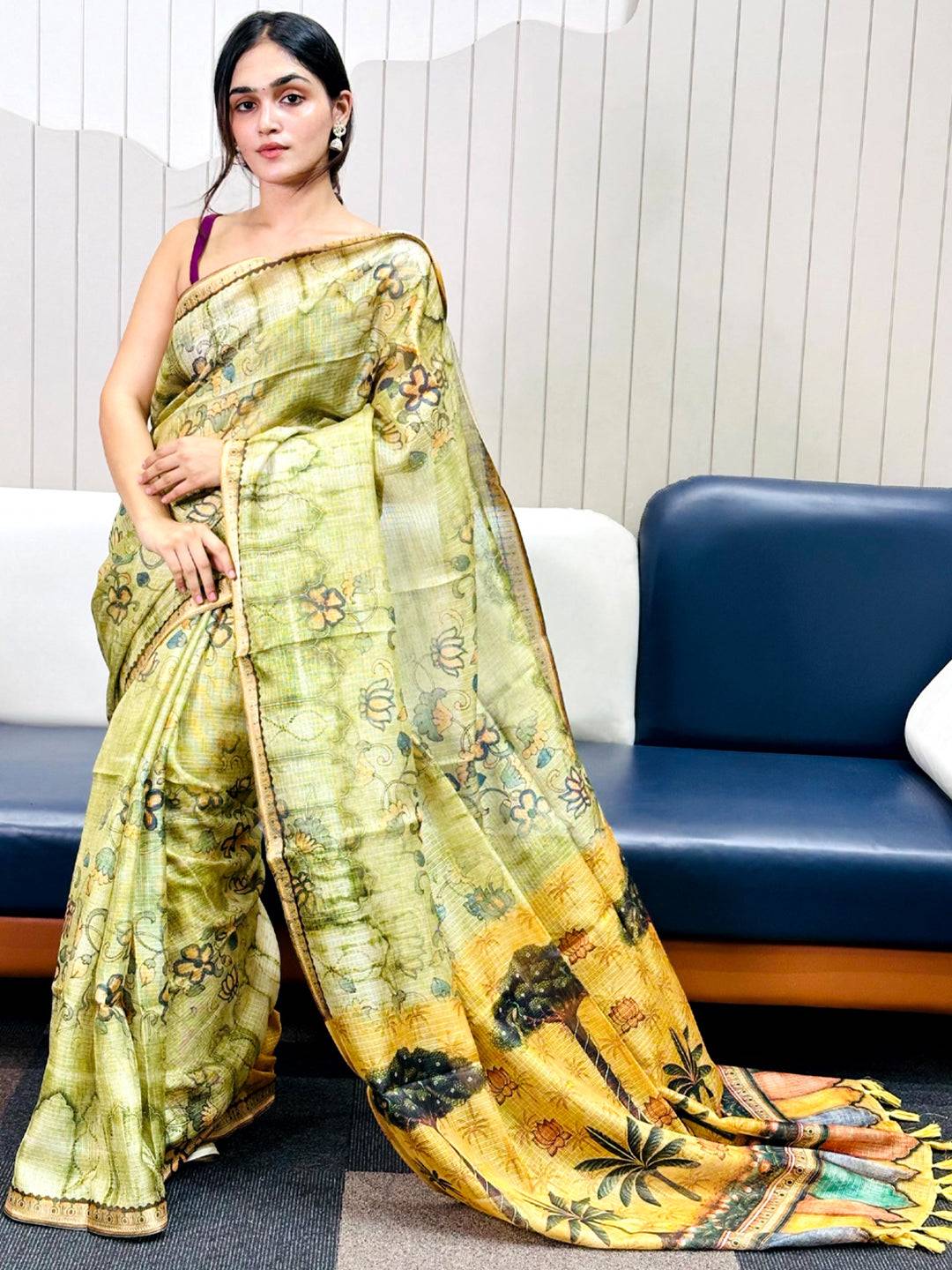Model showcasing light green Kota Doriya silk saree with floral design