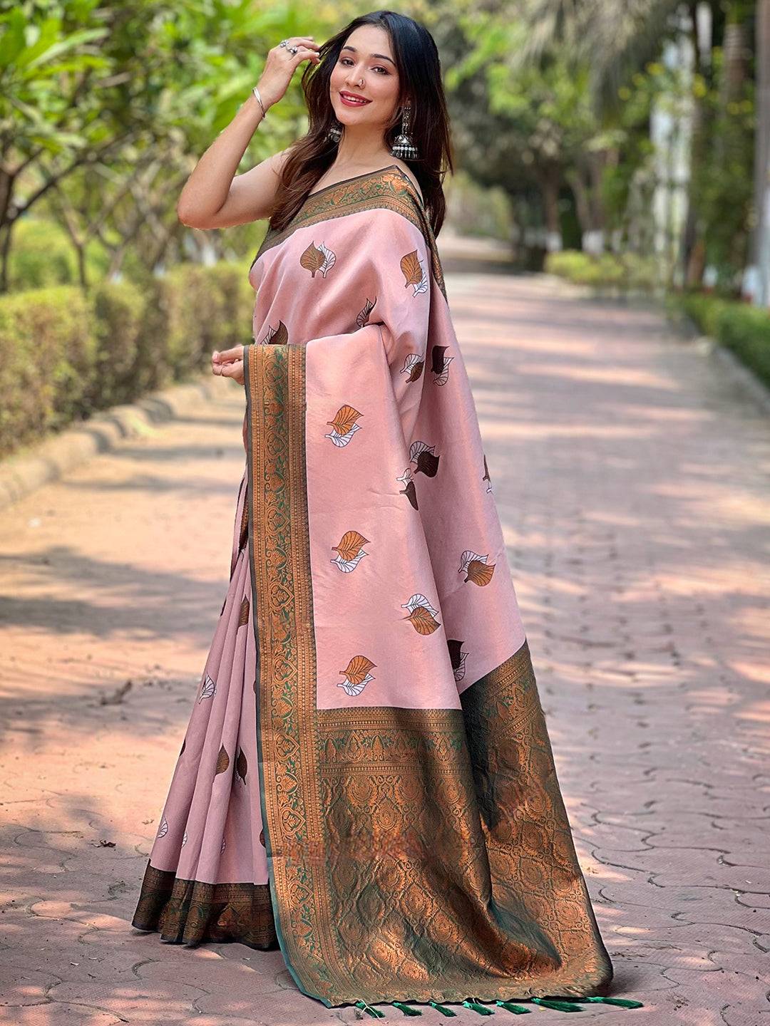 Elegant light pink Kanjivaram saree with gold zari, side view