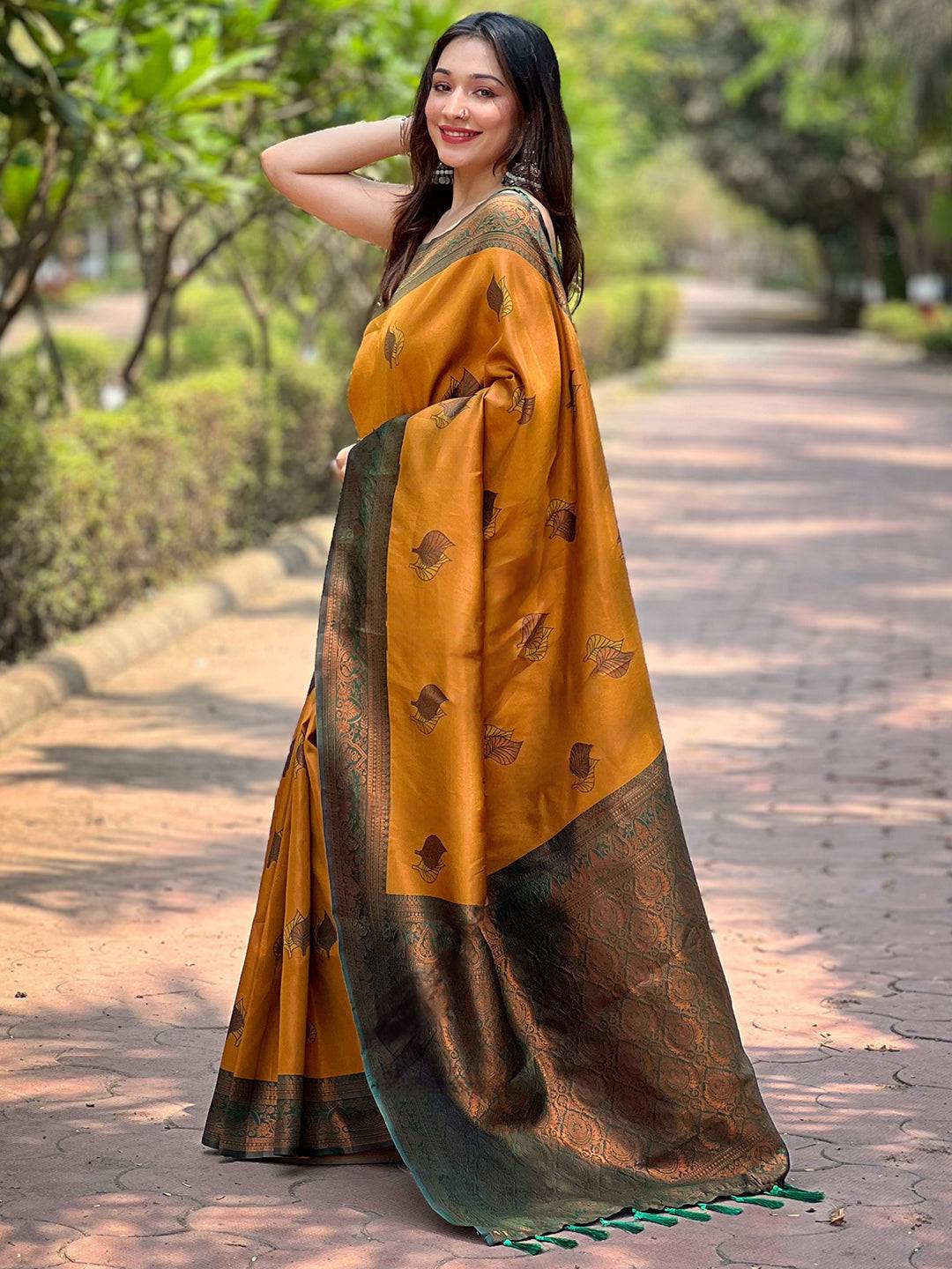 Side view of butterscotch Kanjivaram saree with gold zari weaving