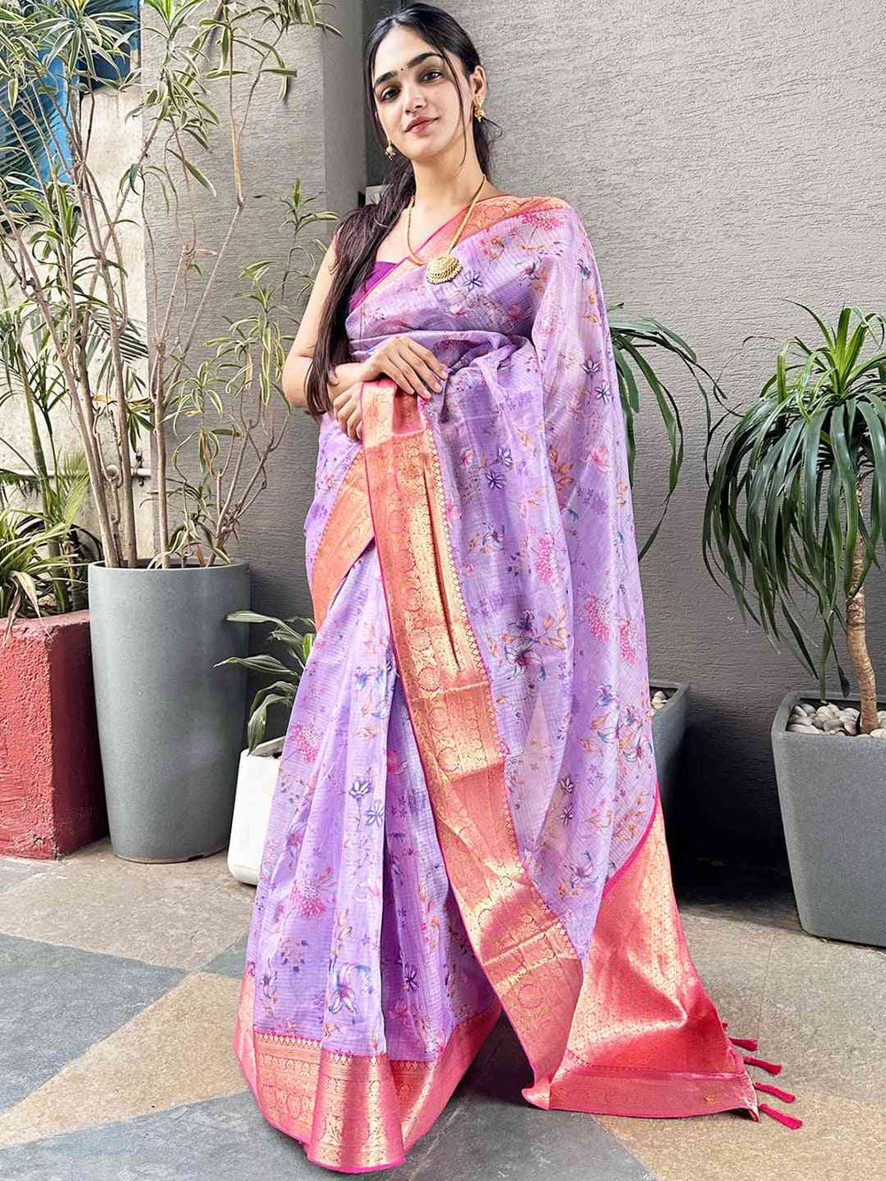 Designer purple saree with digital floral print and gold accents