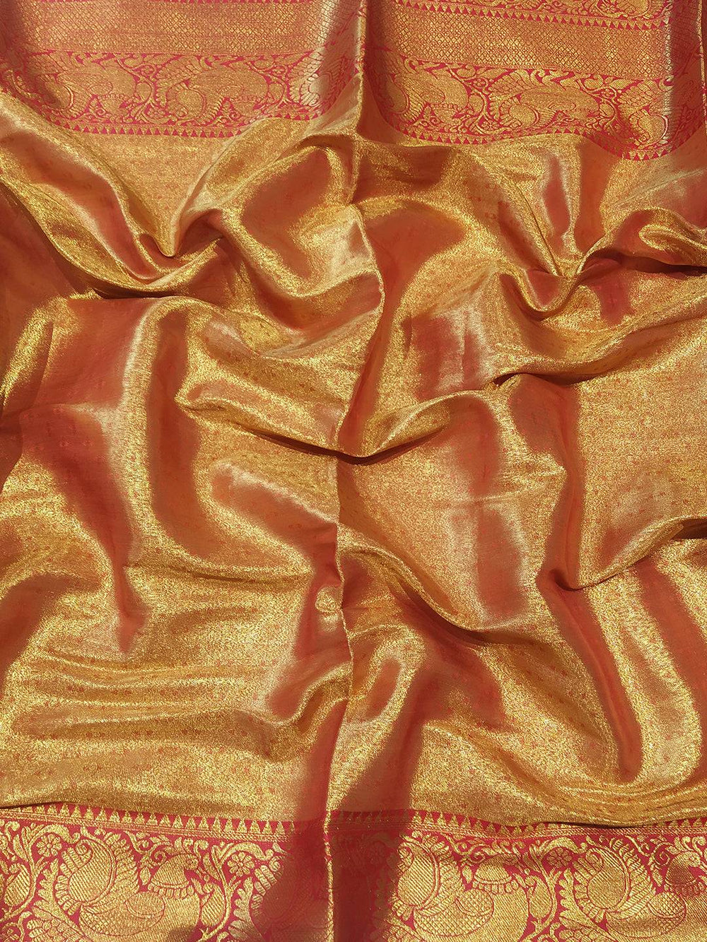 Close-up of light green Banarasi tissue silk saree fabric