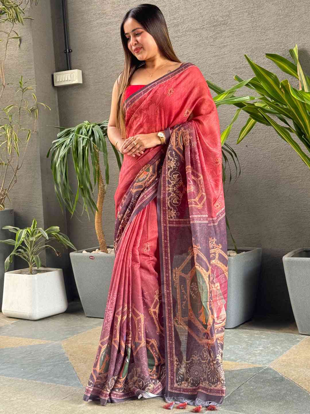 Stylish red saree featuring digital print and ornate border