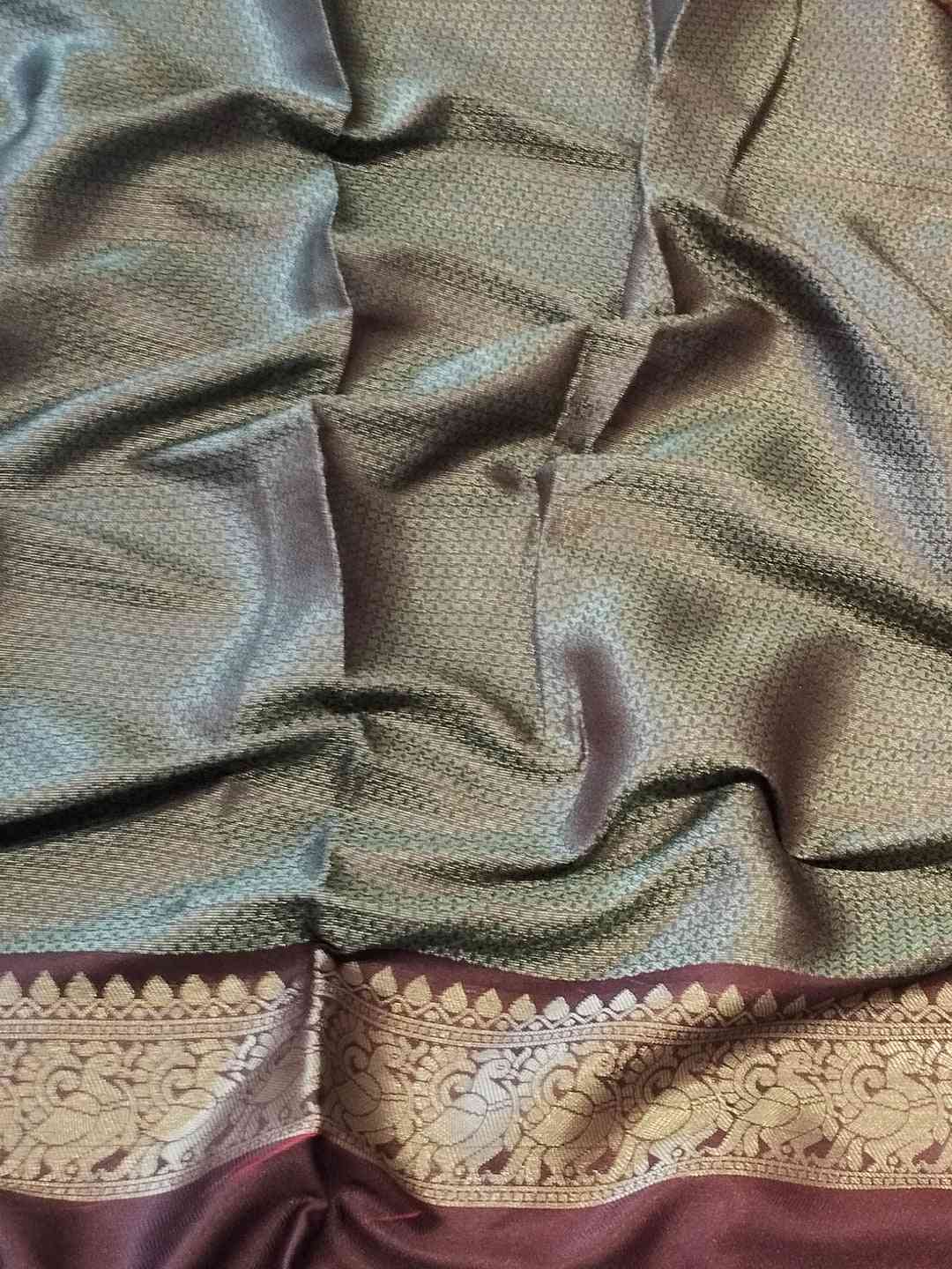 Detailed view of Banarasi silk saree fabric with border