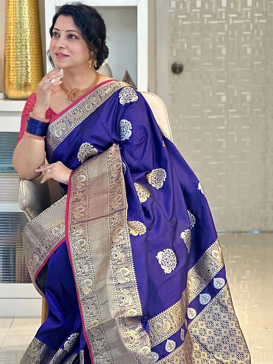 Purple Banarasi silk saree with detailed Kanchi zari patterns.