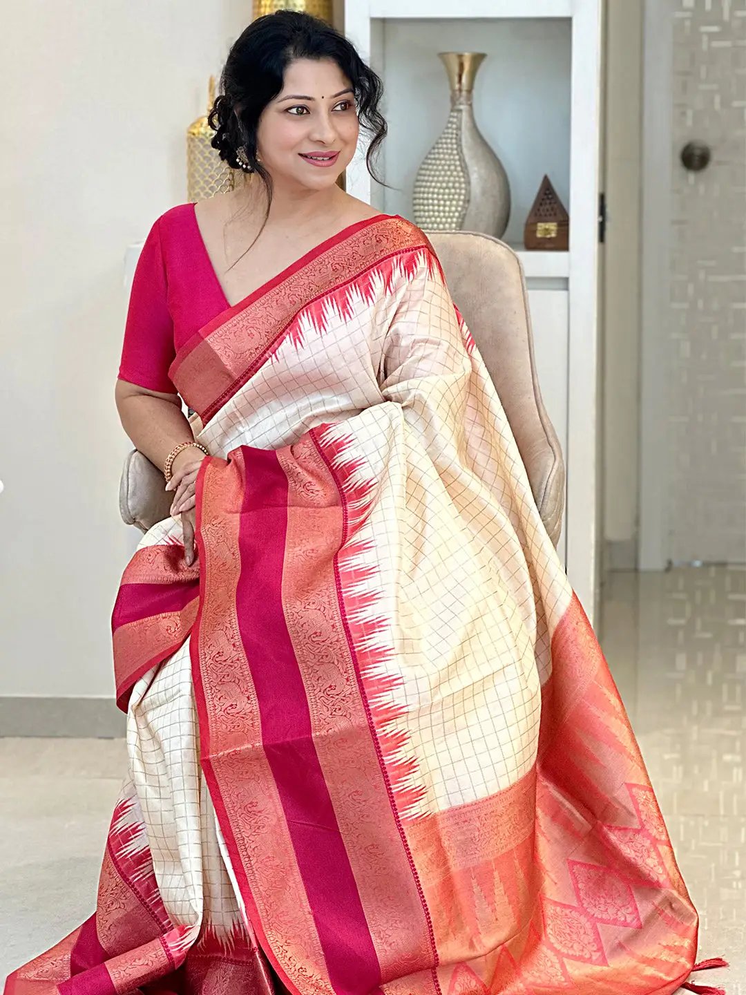White Gadwal Pattu Saree draped elegantly with red accents