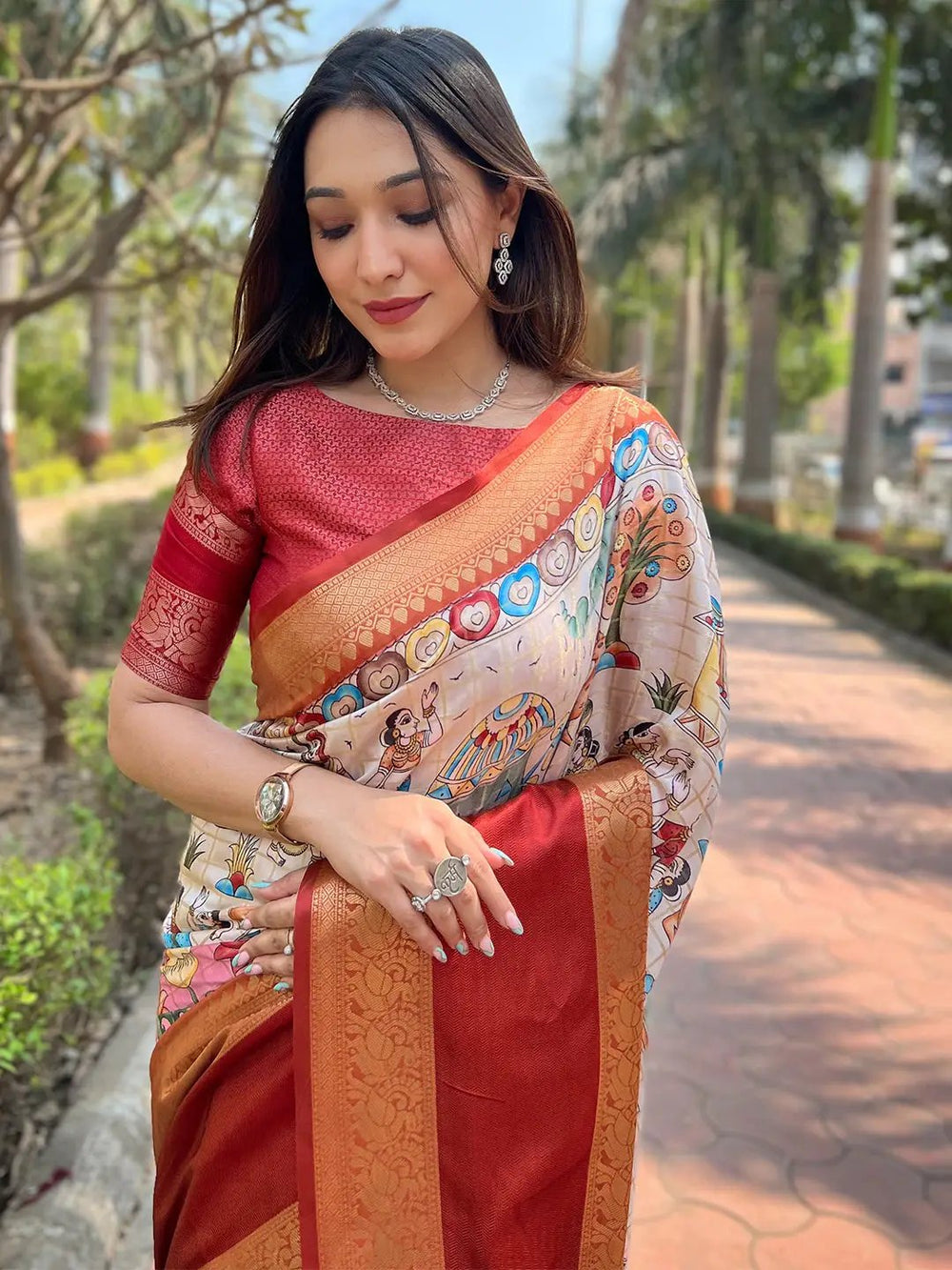 Model wearing a Banarasi saree with ornate design and vibrant hues