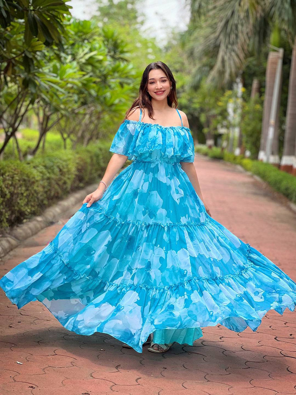 Model twirling in Sky Mist Floral Maxi Dress