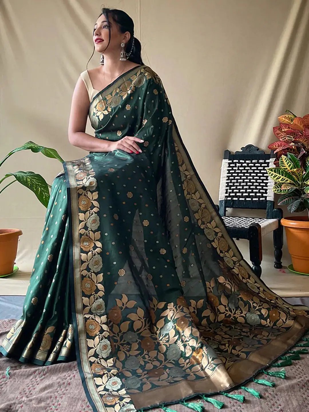 Traditional Banarasi silk saree in bottle green with floral motifs