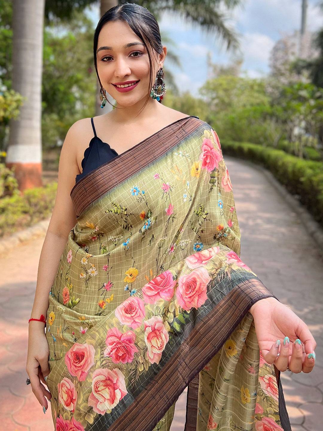 Model wearing pista silk saree with digital floral patterns