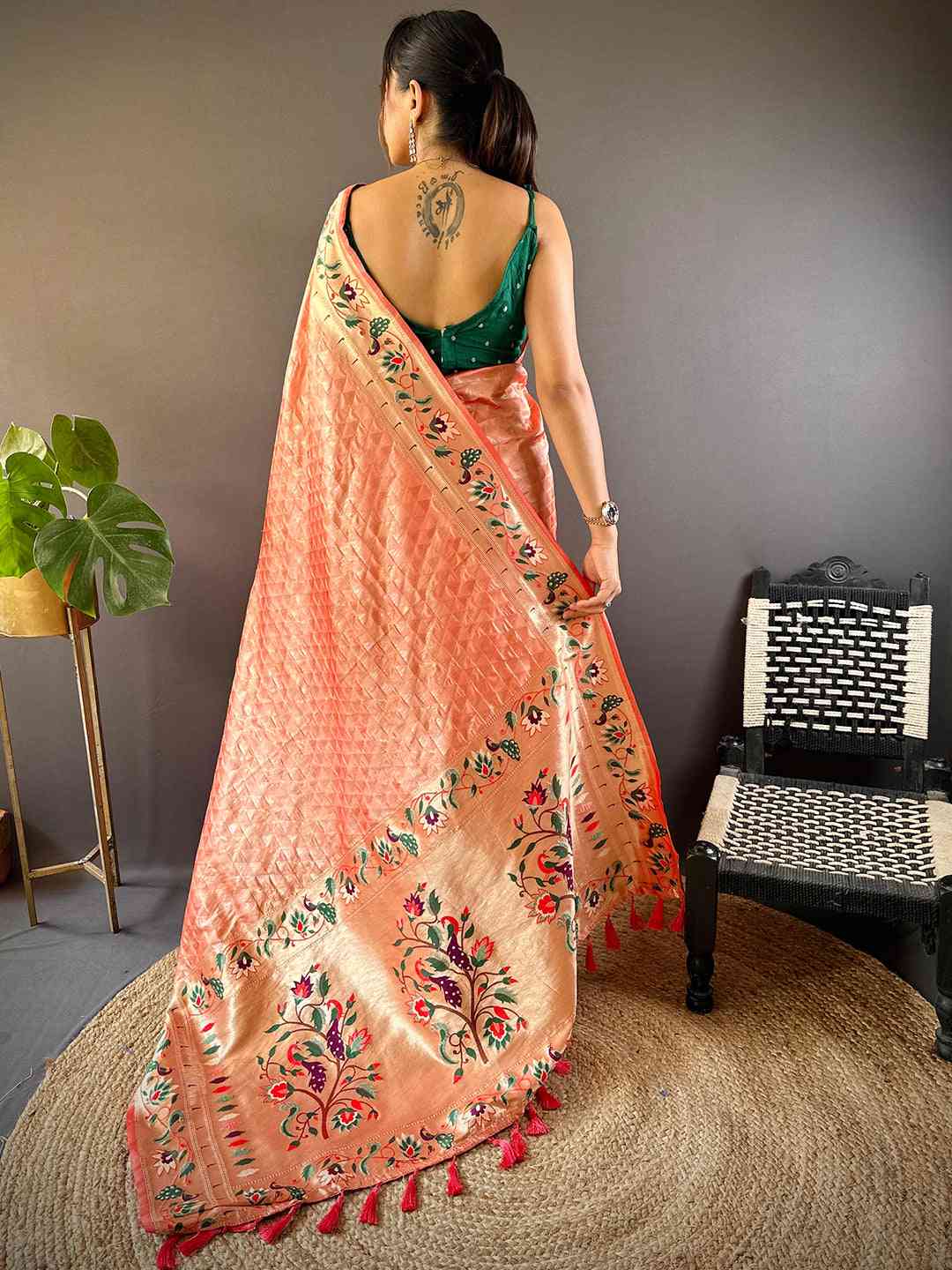 Back view of peach Paithani saree showcasing floral patterns