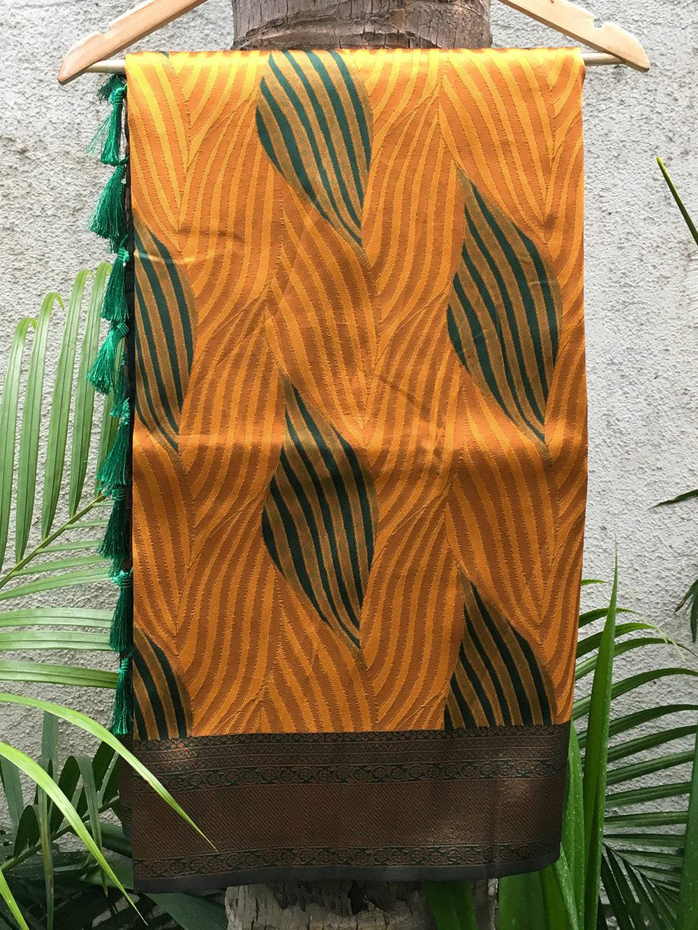 Mustard Tussar Silk Ikkat Saree on Hanger