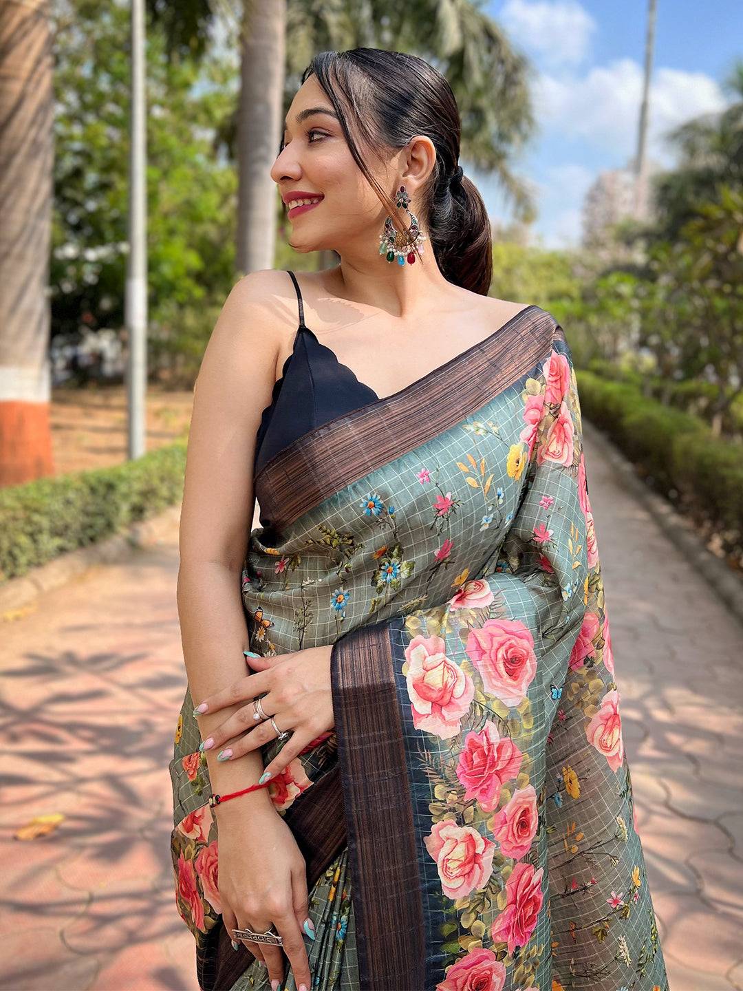 Teal silk saree with copper zari and floral print