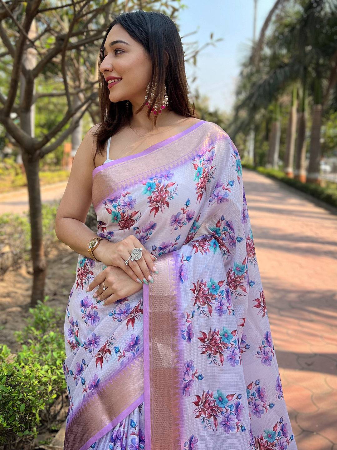 Close-up of digital floral print on light purple saree
