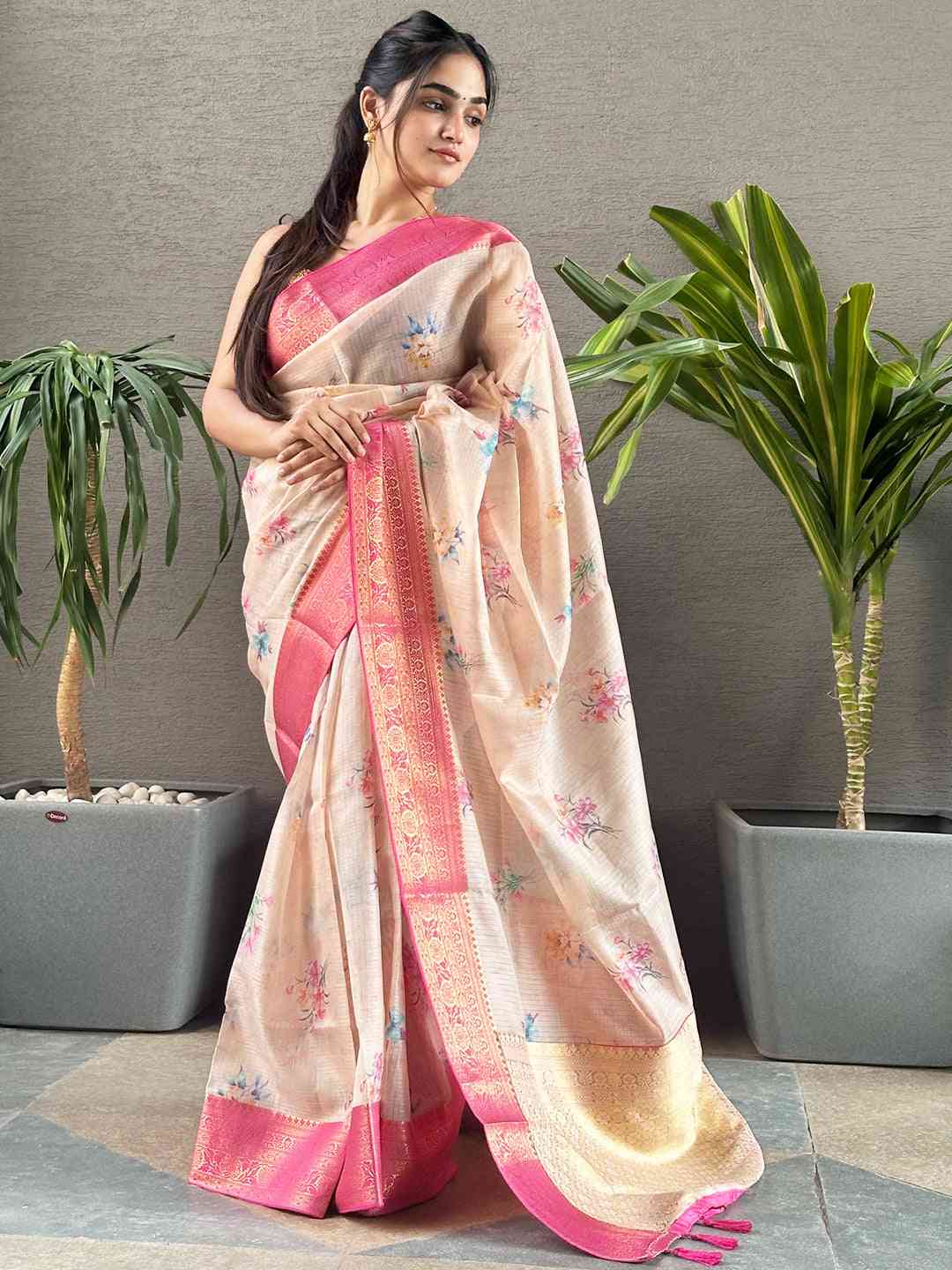 Stylish peach saree with digital flower print and pink border