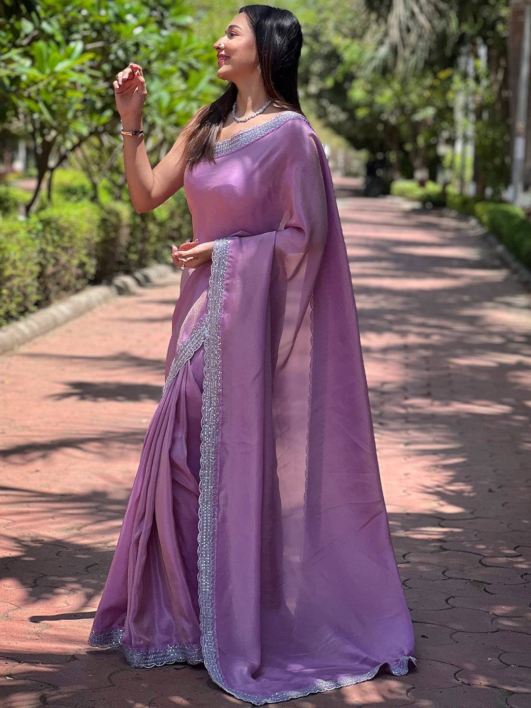 Side view of Salvia Lavender Viscose Saree in garden