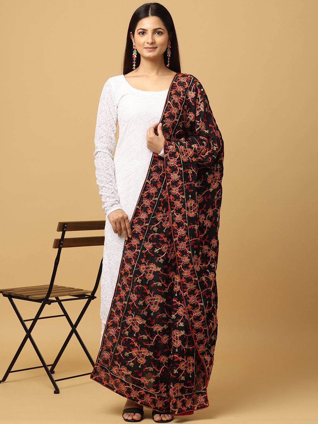 Model wearing black chiffon dupatta with floral thread embroidery.