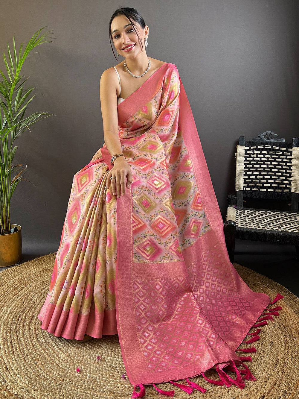 Seated pose with Daisy Pink Flower Vely Print Banarasi Saree.