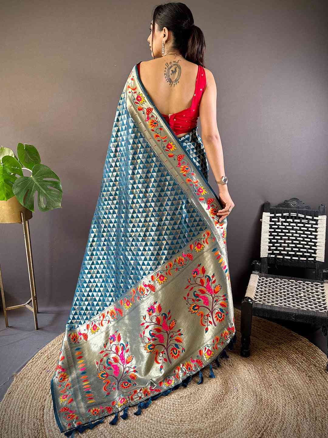 Back view of denim silk blend Paithani saree with floral zari