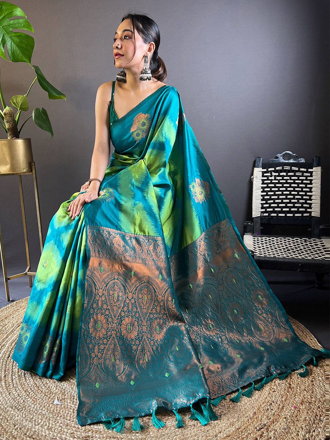 Seated model in Parrot Green Tussar Silk Ikkat Weaving Saree.