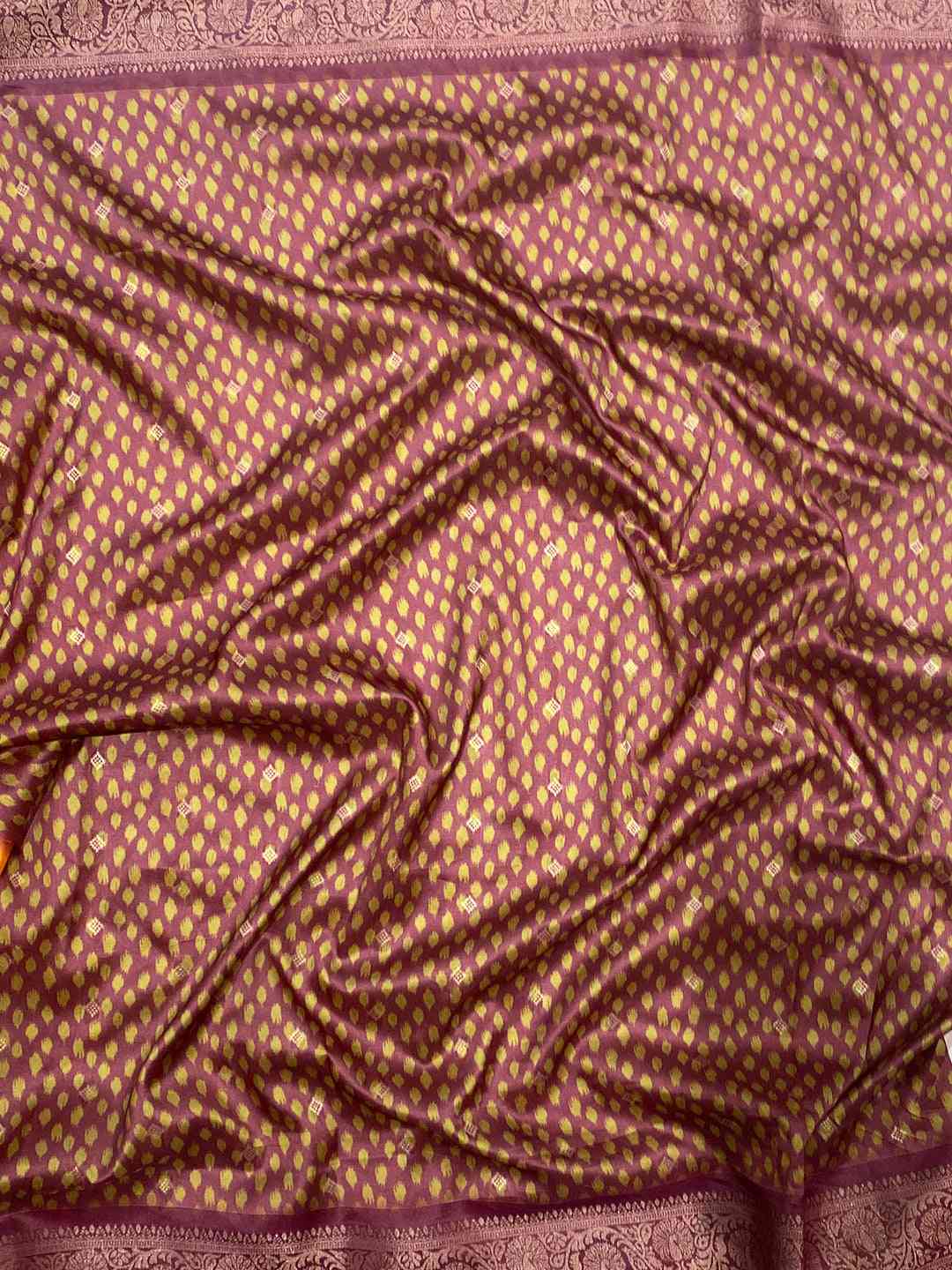 Detailed view of Patola pallu on orange Banarasi silk saree