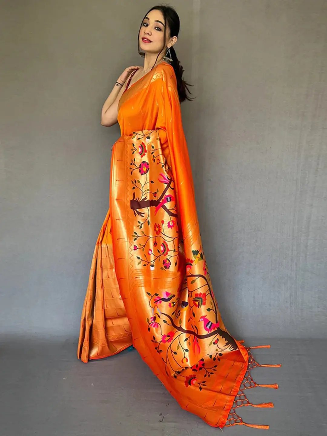 Elegant orange Paithani saree with floral zari design