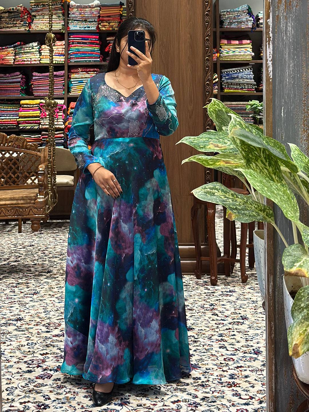 Elegant Blue Galaxy Print Dress displayed in textile shop.