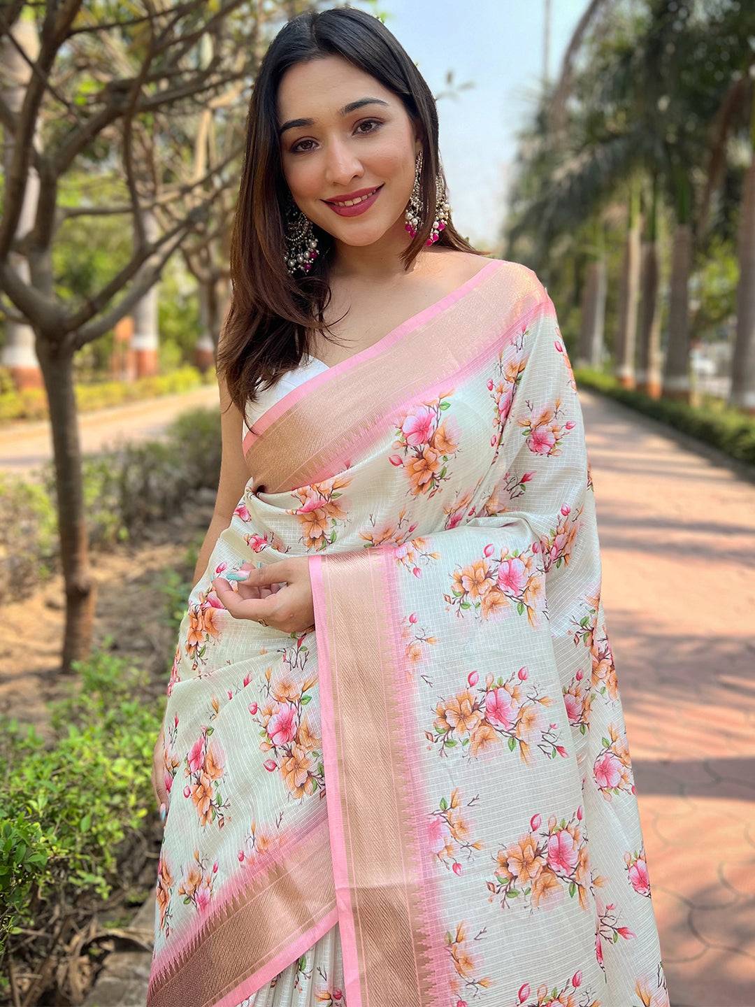 Model Wearing Light Peach Floral Kota Saree