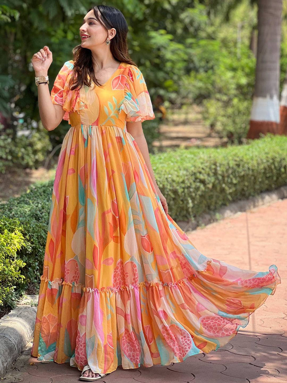 Carnival Yellow V-Neck Dress with abstract print outdoors