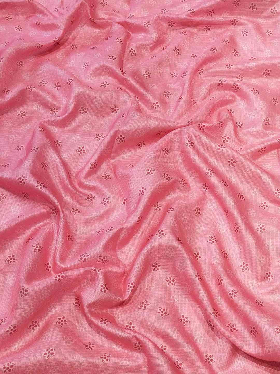 Pink fabric with delicate floral embroidery details